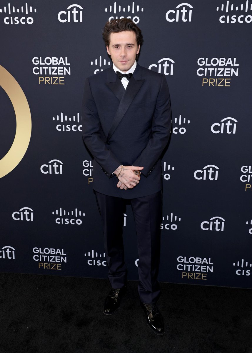 Stepping out in style.
Brooklyn Peltz Beckham turned heads at the Global Citizen Prize in a sleek Dior Men's collection navy wool and silk lapel tuxedo paired with a classic white cotton shirt, a navy bow-tie, and polished black derbies by Kim Jones.
#StarsinDior