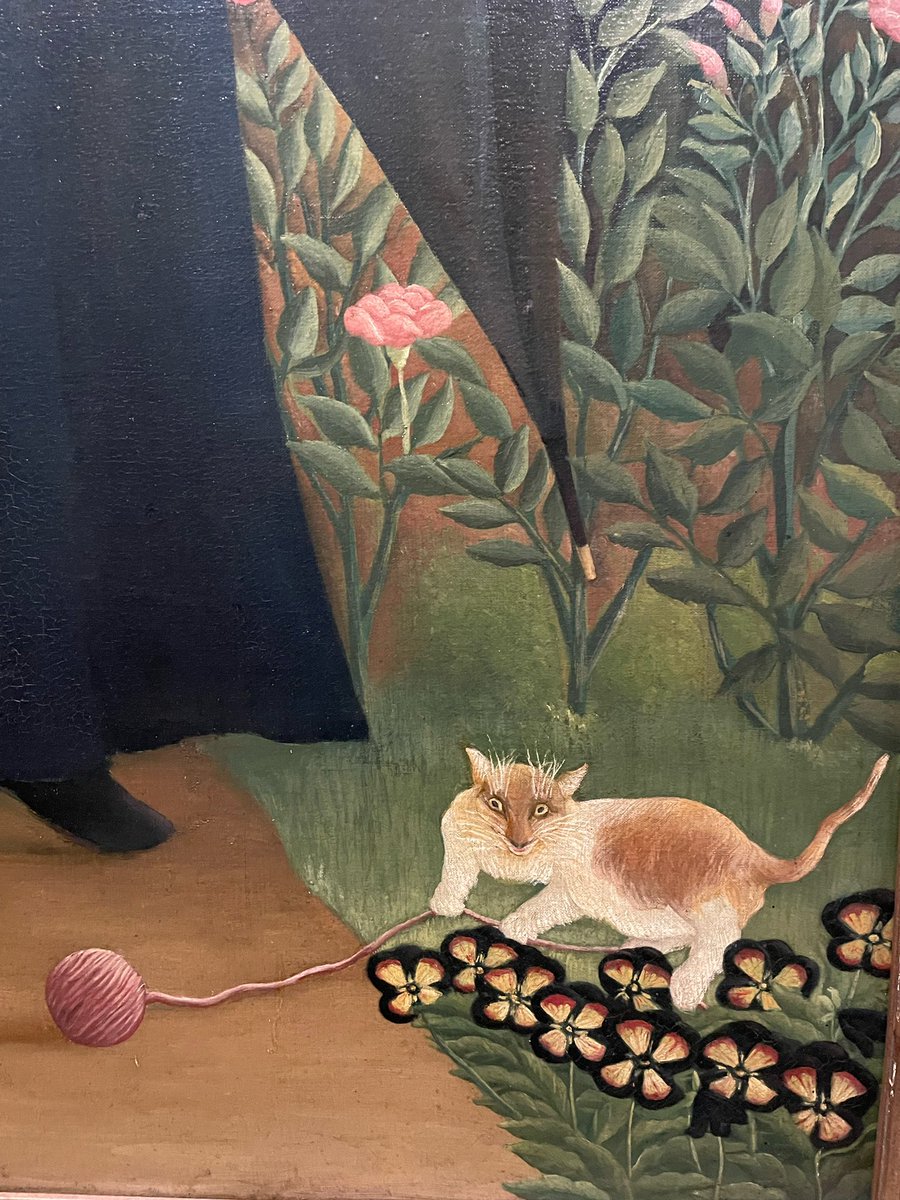 Mischievous cat with a ball of wool- a detail of a painting by the naive painter Henri Rousseau. Musee d’Orsay