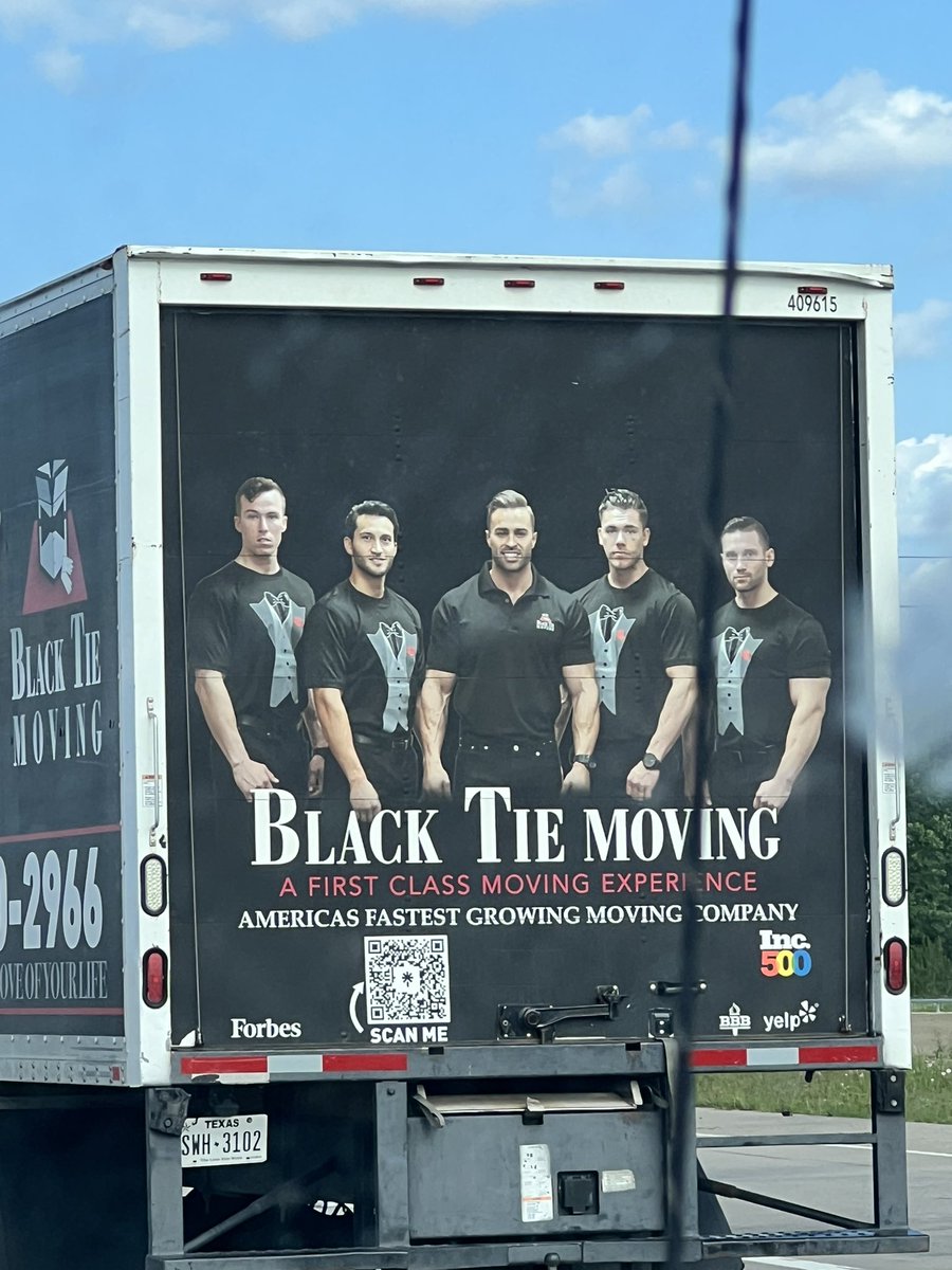how come the back of this moving company truck looks like a cross between a metalcore band and a fraternity photo