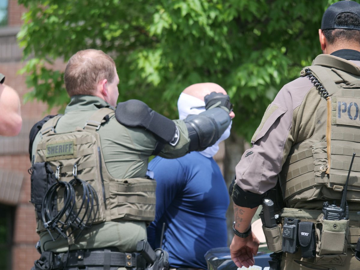 So, just for the historical record, here are some shots of the Patriot Fronters as they were having their masks removed in Coeur d'Alene on June 11 2022. I mostly have a lot of before-and-after shots.