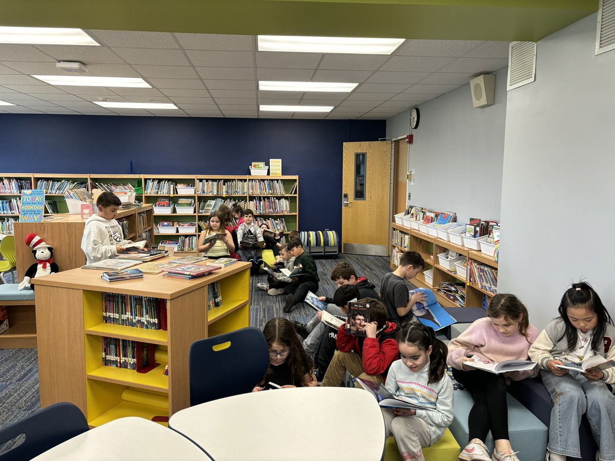 Day 3 of #GetCaughtReading Month! Sometimes we catch a whole class reading! #CBSProud #WeAreBethpage 💛💙💛💙