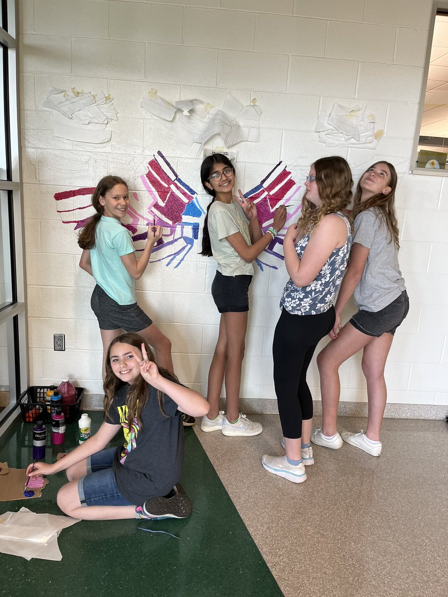 DAISLibrary's tweet image. Team Respect girls are working hard on a mural outside the library!🥰🪽
