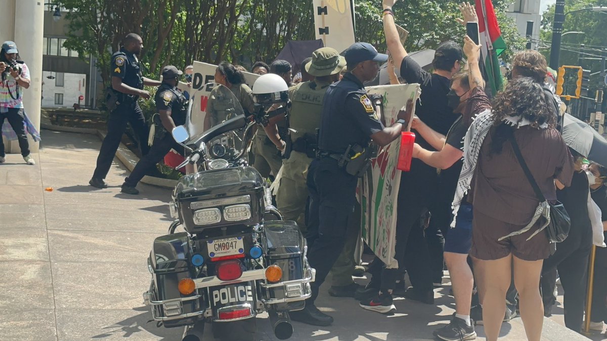 Protesters clashed with police at Georgia State University off Auburn Ave and Park Place. After a few minutes protesters separated and continued marching.