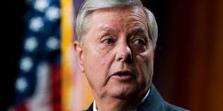 Lindsey Graham says the FBI took his phone after someone impersonating Chuck Schumer called him. The scam was only uncovered after a hopeful Lindsey waited for five hours at a downtown cafe, wearing a tight sweater and carrying a book with a rose in it