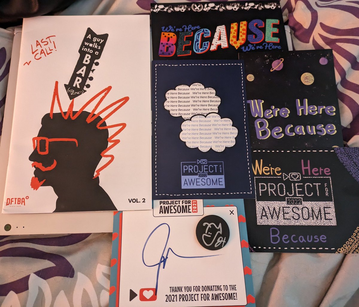 I just got my P4A past bundle from #P4A2024 and I love the things in it so much! There's a variety of we're here because themed things, a Nerdfighter art zone, and a little something signed by both Hank and John! Thank you @DFTBArecords for always remembering to be awesome! 💖