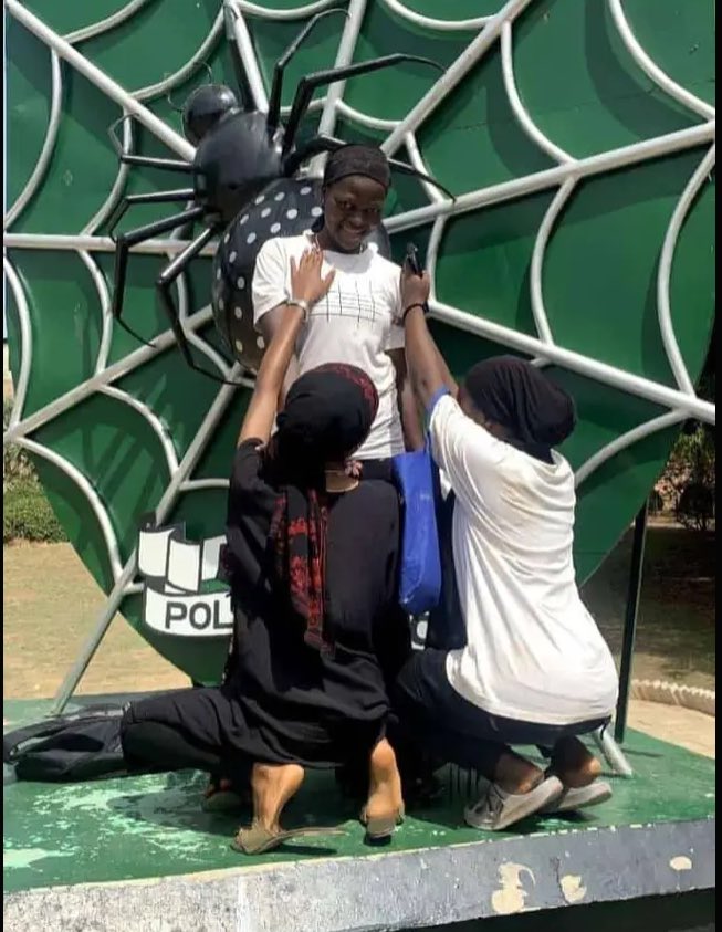 Freshers taking pictures on kaduna polytechnic logo statue without knowing what it stands for😂