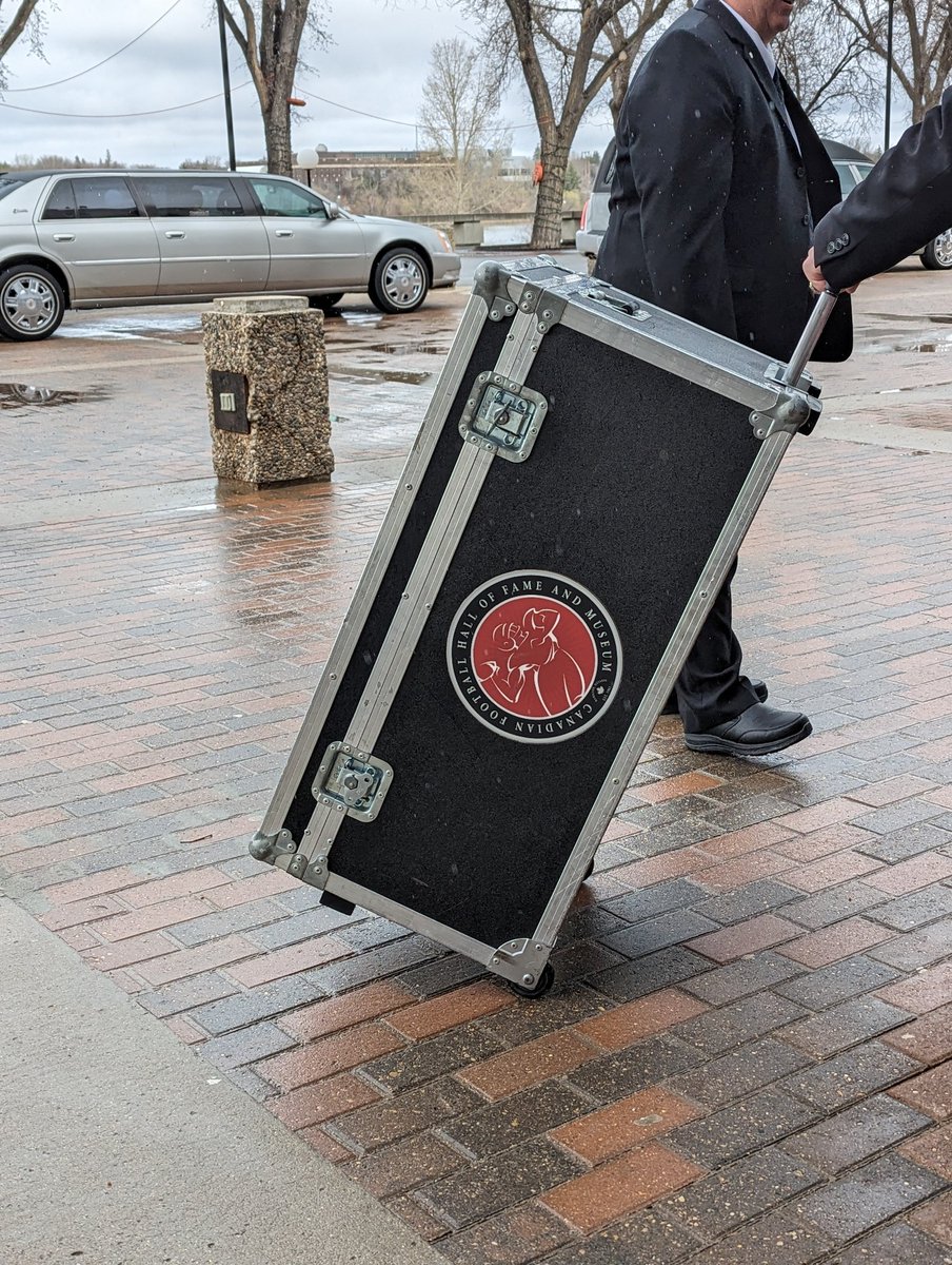 DawsonNewsNet's tweet image. The Grey Cup Jim Hopson hoisted at old Mosaic in 2013 is in the house, as the Celebration of Life for Hopson starts at Conexus Arts Centre at 3pm. The parking lot is filling fast, as people are arriving to pay tribute to this remarkable person.
