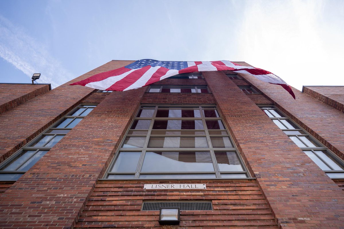 GW staff hung a giant American flag from Lisner Hall overlooking the encampment