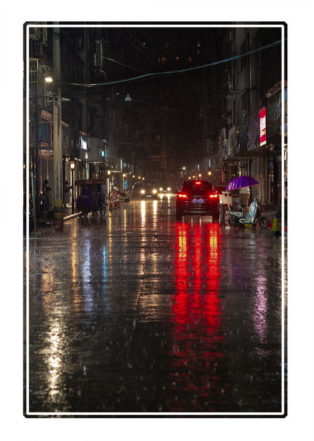 A #heavy #rainfall during the #night on the #streets of #Xindu in #Sichuan #province. The #reflections show how much #water has fallen #streetphotography #nightphotography #ThePhotoHour #photography shot on #Nikon #weather #extremeweather. see more at darrensmith.org.uk