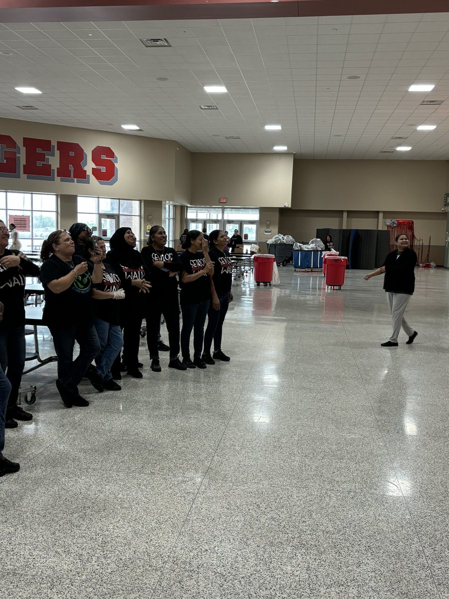 Our wonderful cafeteria staffulty taking a moment to enjoy a video tribute from our students. #TravisWay