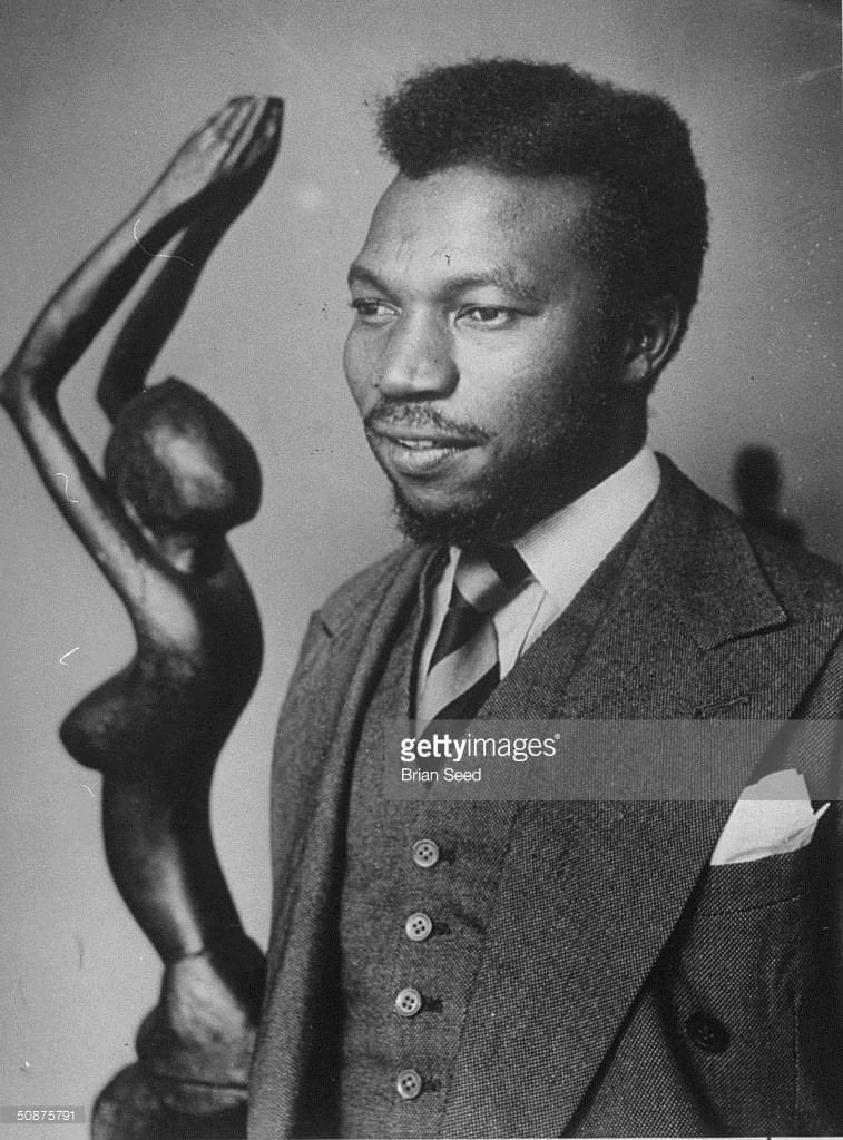 The legendary Nigerian painter and sculptor ODINIGWE BENEDICT CHUKA ENWONWU, London circa 1949. 24 yrs old Enwonwu joined the the faculty of arts at EDO COLLEGE in 1941 and claimed Benin as his spiritual home. 
He was accepted into apprenticeship with the IGUNEROMWON GUILD and…