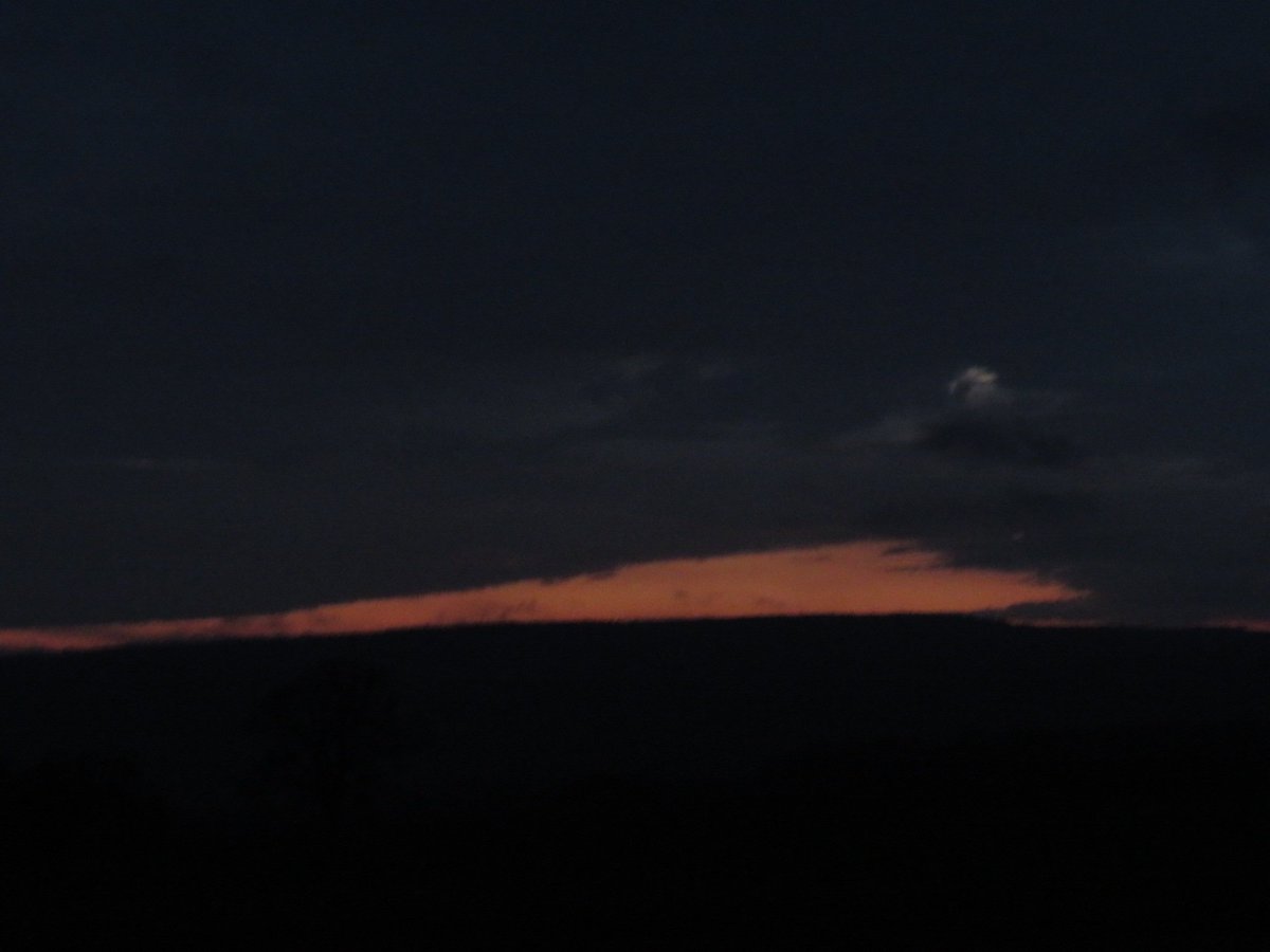 evening plays out in soft grey fade, gaps of colour: 21.55, last brush-stroke of afterglow