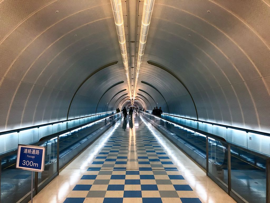 Tunnel at Narita Airport in Japan buff.ly/3UleJqu #photography #travel  #tunnel #terminal #NaritaAirport  #Tokyo #Japan #narita #architecture #underground #narita #people #patterns