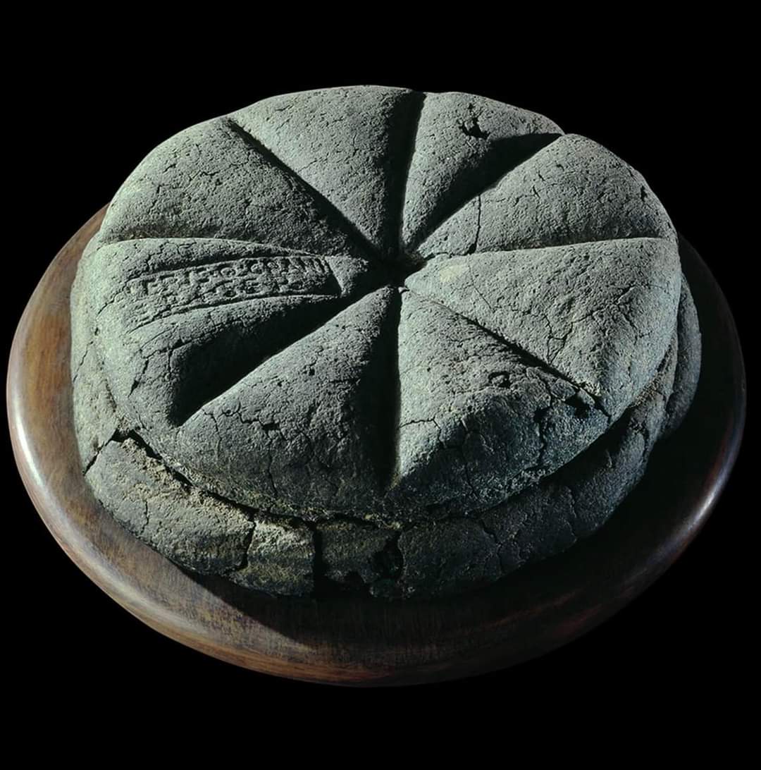 A loaf of bread with a stamped imprint found in Herculaneum and dated back to 1st Century AD, bears the name of its baker. Unearthed in 1930, this sourdough loaf was baked on the morning of August 24th, 79 AD. Turned to carbon and preserved by the oven it was baked in, the loaf