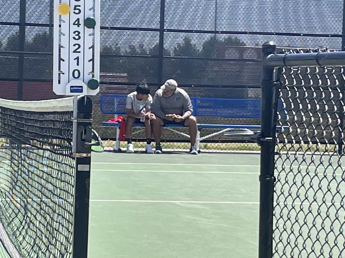 This is a great picture of a coach to athlete moment. This is also a father to son moment. Mojo Tennis - 2-6A District Tournament 2024 Ratliff Stadium.