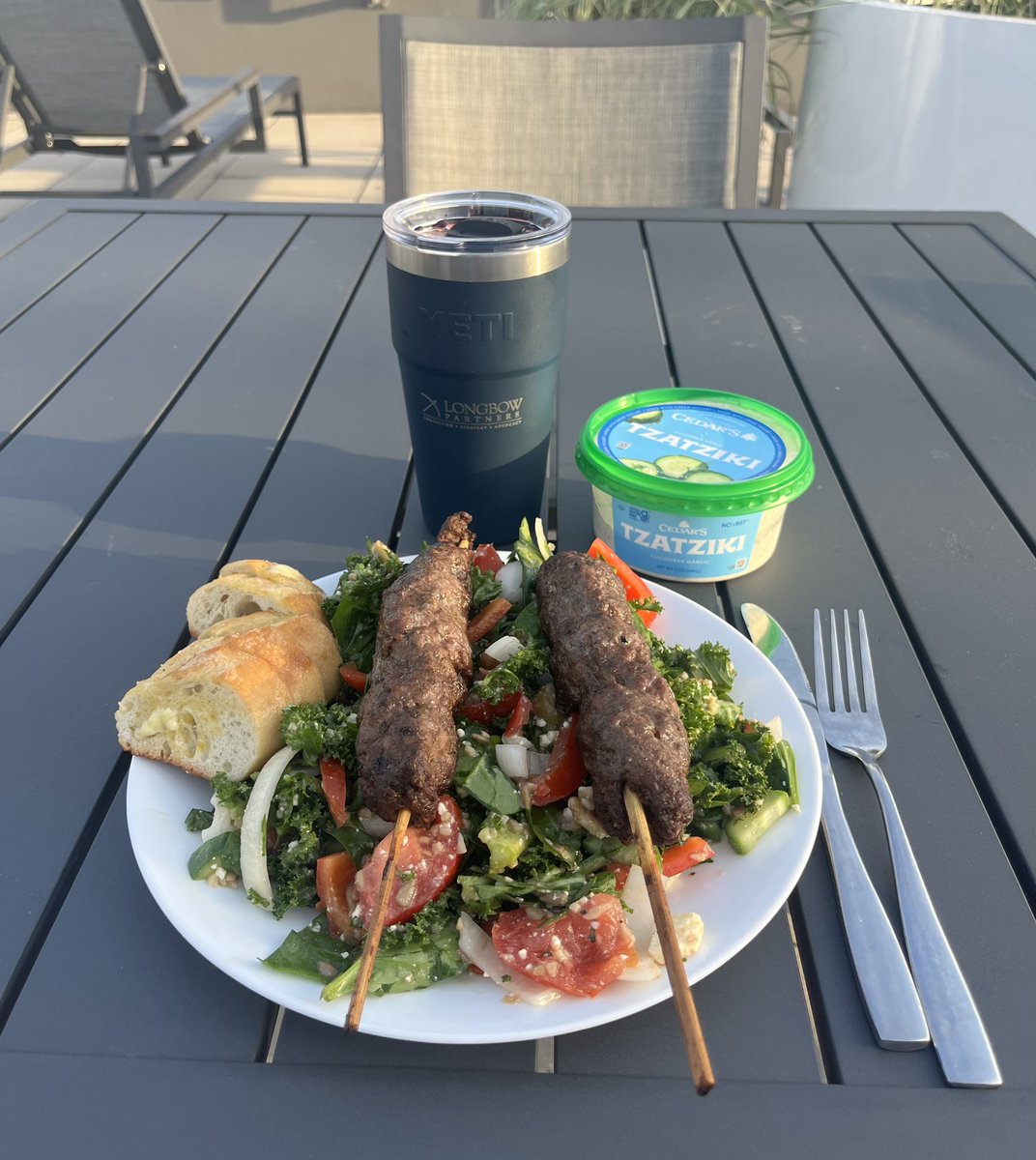 Decided to supp on the roof before the rains come tomorrow. Moroccan lamb kabobs w Tzatziki and a two glasses of Sonoma County Cab in the Yeti #twittersupperclub