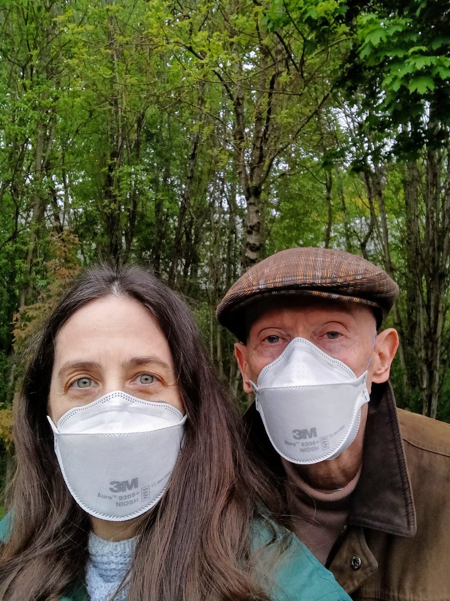Mr. & Mrs. M, out for an afternoon walk in the neighborhood, wearing their respirator masks, as always, to keep safe during the ongoing pandemic of Covid-19.