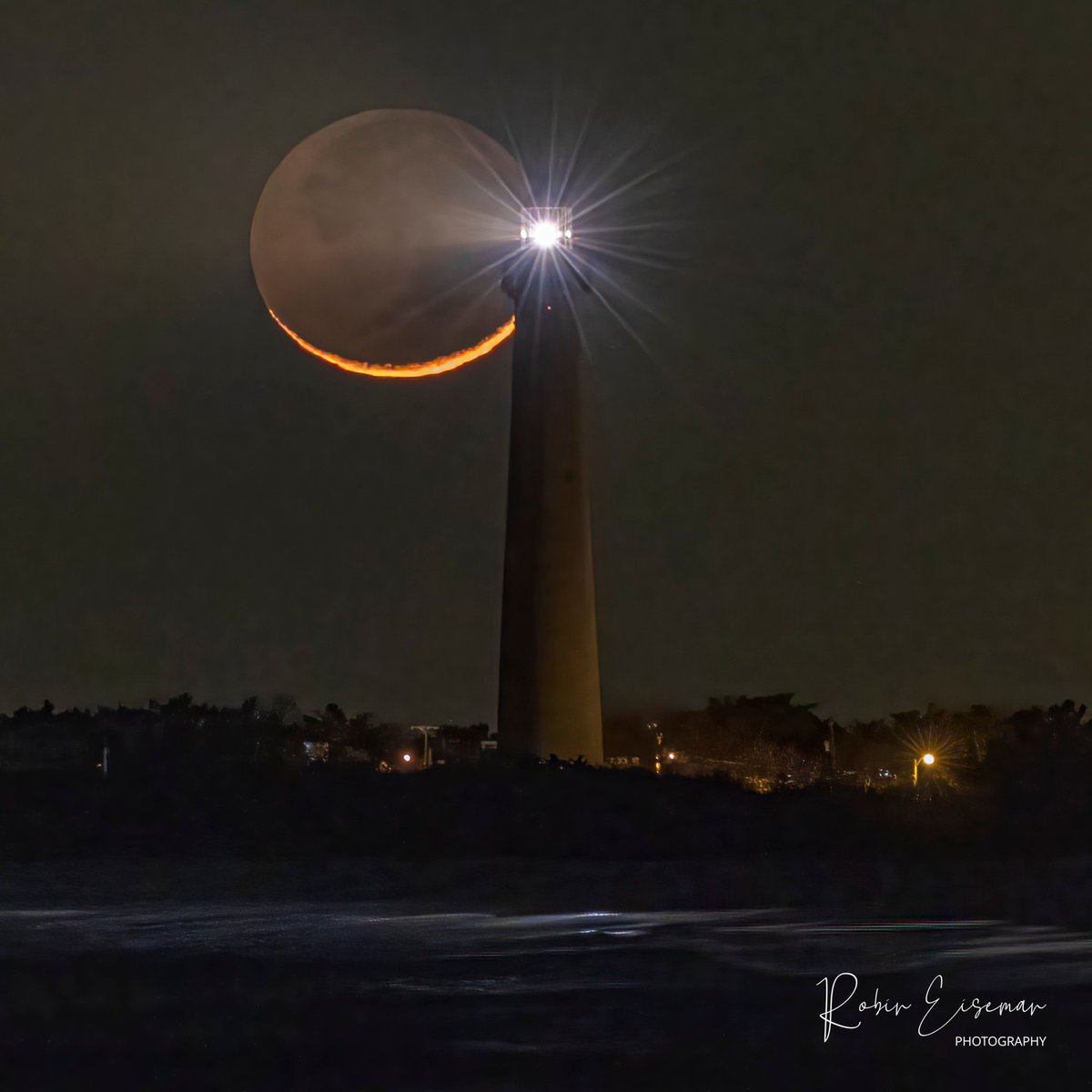 4% waxing crescent moon behind the Cape May Lighthouse. #VisitNJ #CapeMay #CapeMayLighthouse 
📷 IG: robineiseman_photography