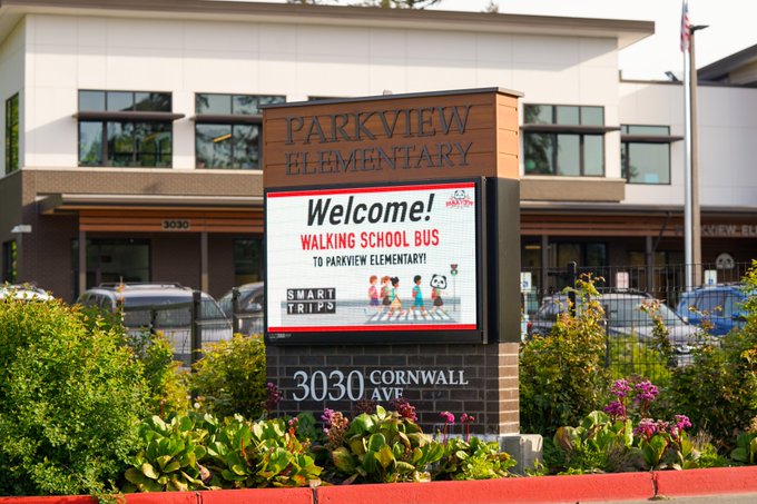 Electronic reader board welcomes walking school bus to school