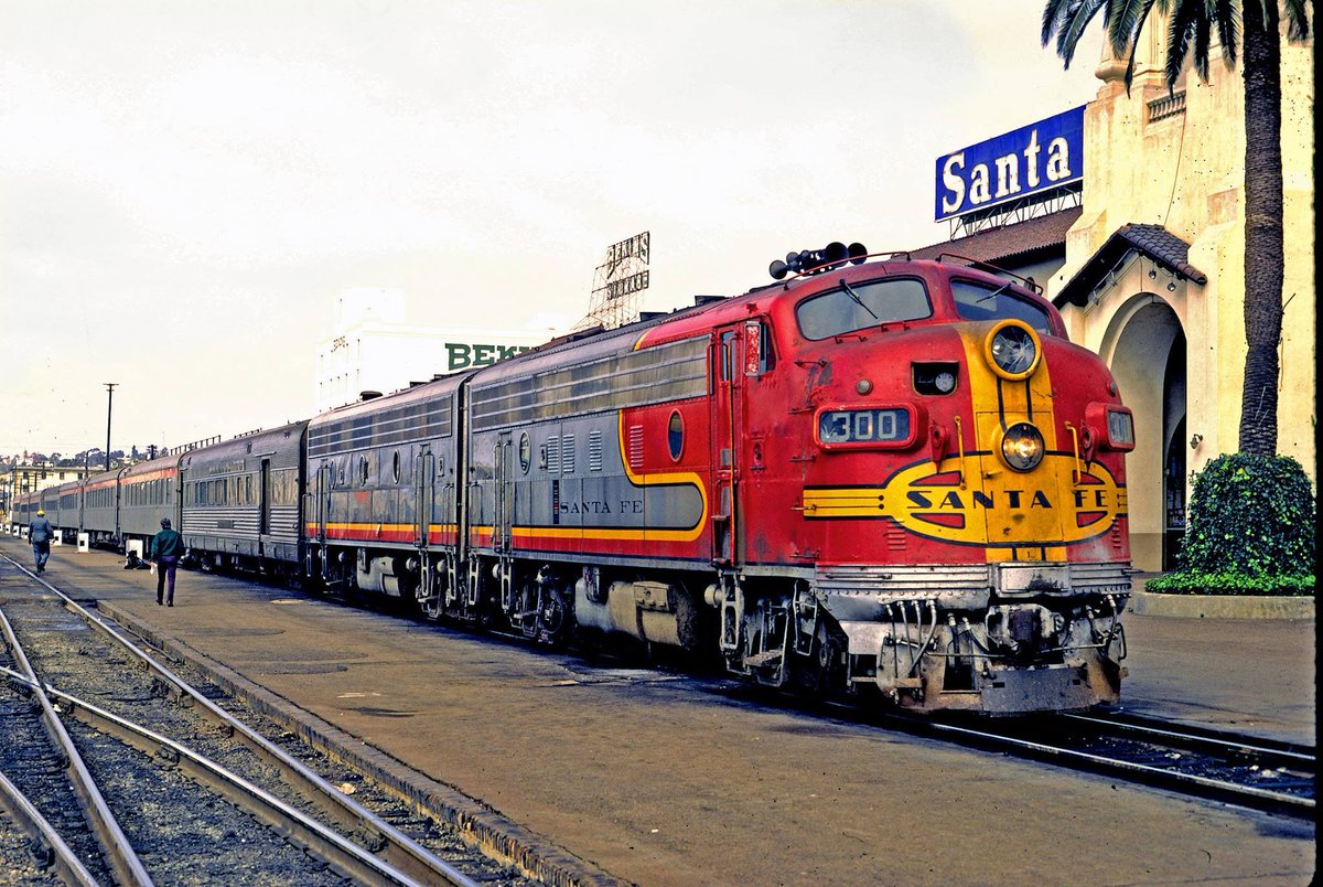 Santa Fe F7's labor on under the Amtrak banner with a San Diegan at the beautiful station in San Diego, California during March of 1973. Drew Jacksich photo. american-rails.com/diegan.html