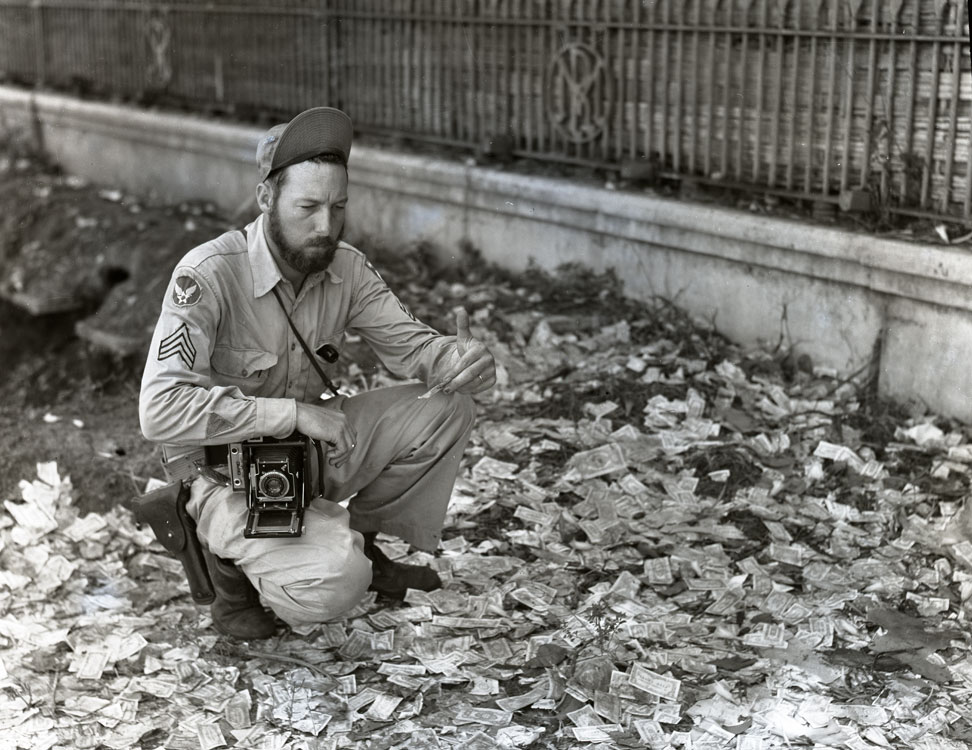 Sgt Frank Bond, a photographer with the USAAF 40th Photo-Recon Squadron, found the streets littered with Japanese Occupation Currency as US forces entered Rangoon, Burma (now Yangon, Myanmar), May 3 1945