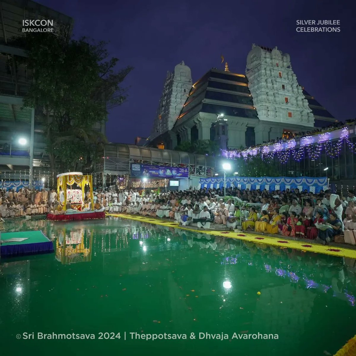 The grand festival of Sri Brahmotsava 2024 drew to a close yesterday with Theppotsava. Sri Radha Krishnachandra were adorned in Sri Yamunatira-Vanachari alankara. They received a pleasure boat ride in the temple's Kalyani. Following the boat ride Dhvaja Avarohana ceremony was