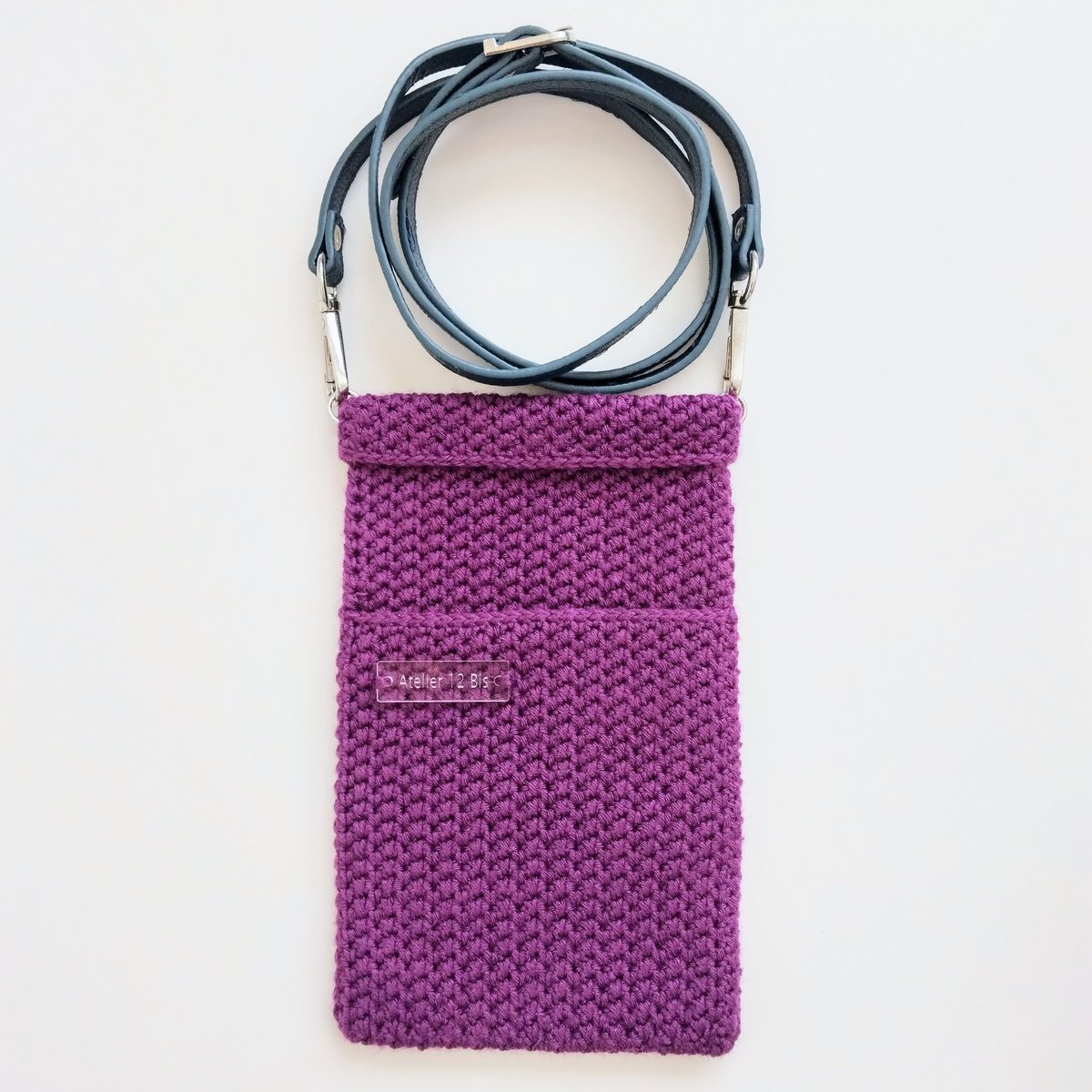 Made one last purple phone bag ! Available in-store only ! Last one ! #handmade #knitting #handmadebag #crochet #crochetbag #bag  #summervibes #handbag #summertime #colourful #springfashion #mobile #mobilephone #phonecase #phonebag #phone #purple #crocheted #atelier12bis