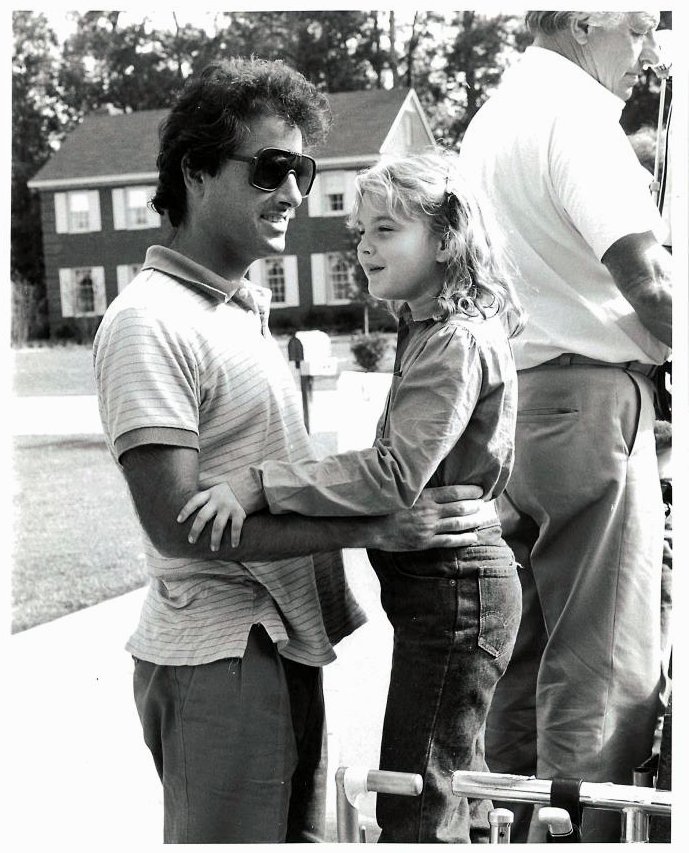 Drew Barrymore and director Mark L. Lester on the set of 'Firestarter' (1984)