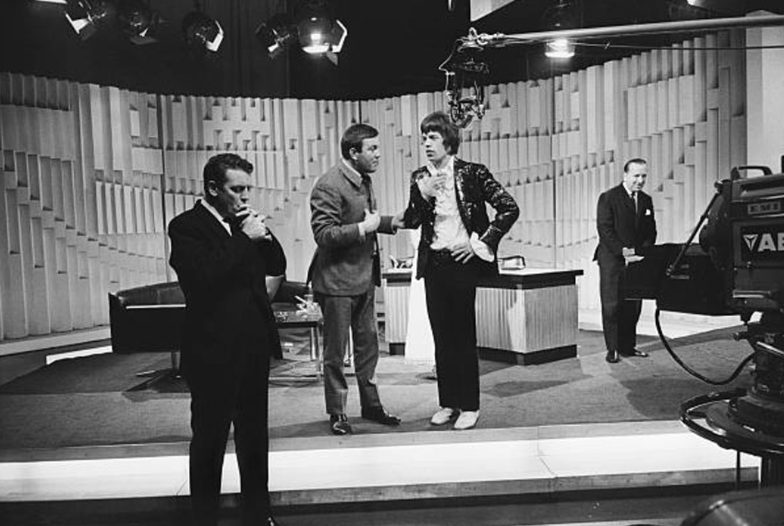 Terry Scott enjoys a natter with Mick Jagger whilst Eamonn Andrews and Hugh Lloyd are lost in their own thoughts.