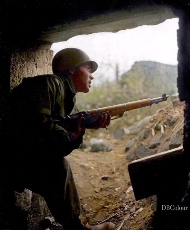 Pfc. Morton Fernberg, Vineland, N.J., an infantryman with the 13th Regiment, 8th Division, First US Army, takes shelter from an artillery barrage in Duren, Germany.
24 February 1945.

Photographer: Braun

Source- US Army Signal Corps Archive.

Colourised by Doug