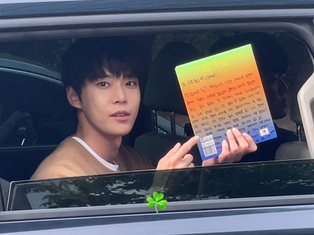 Doyoung proudly showing his signed album with personal essay by boynextdoor jaehyun? 😭