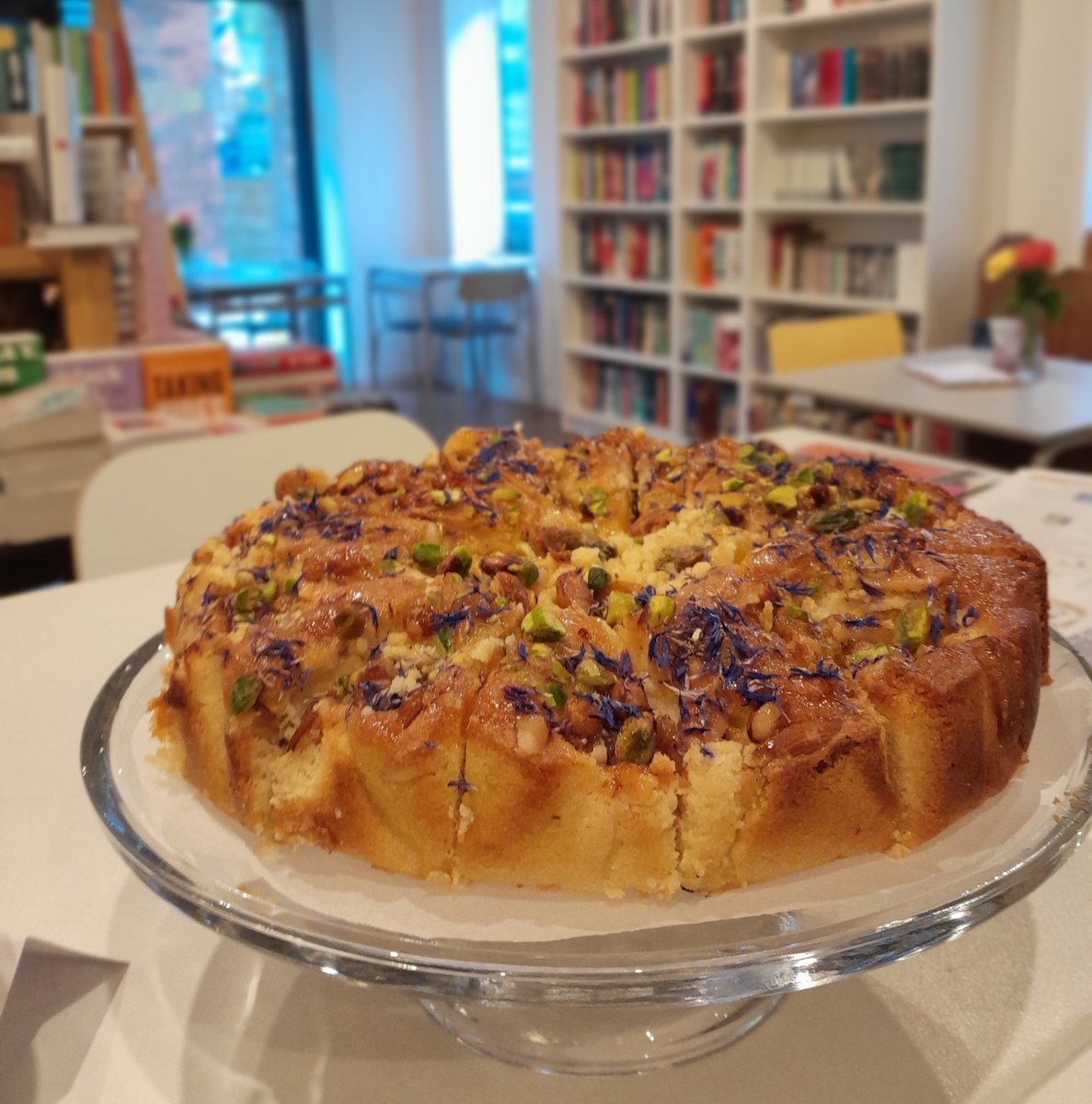 Two things. 1. We're having a SALE! 50% off selected books between today and Monday. This is only for a limited time over the Bank Holiday, so head down to see what we've got discounted! 2. New cake on the counter. Apricot & pistachio frangipane. That is all.