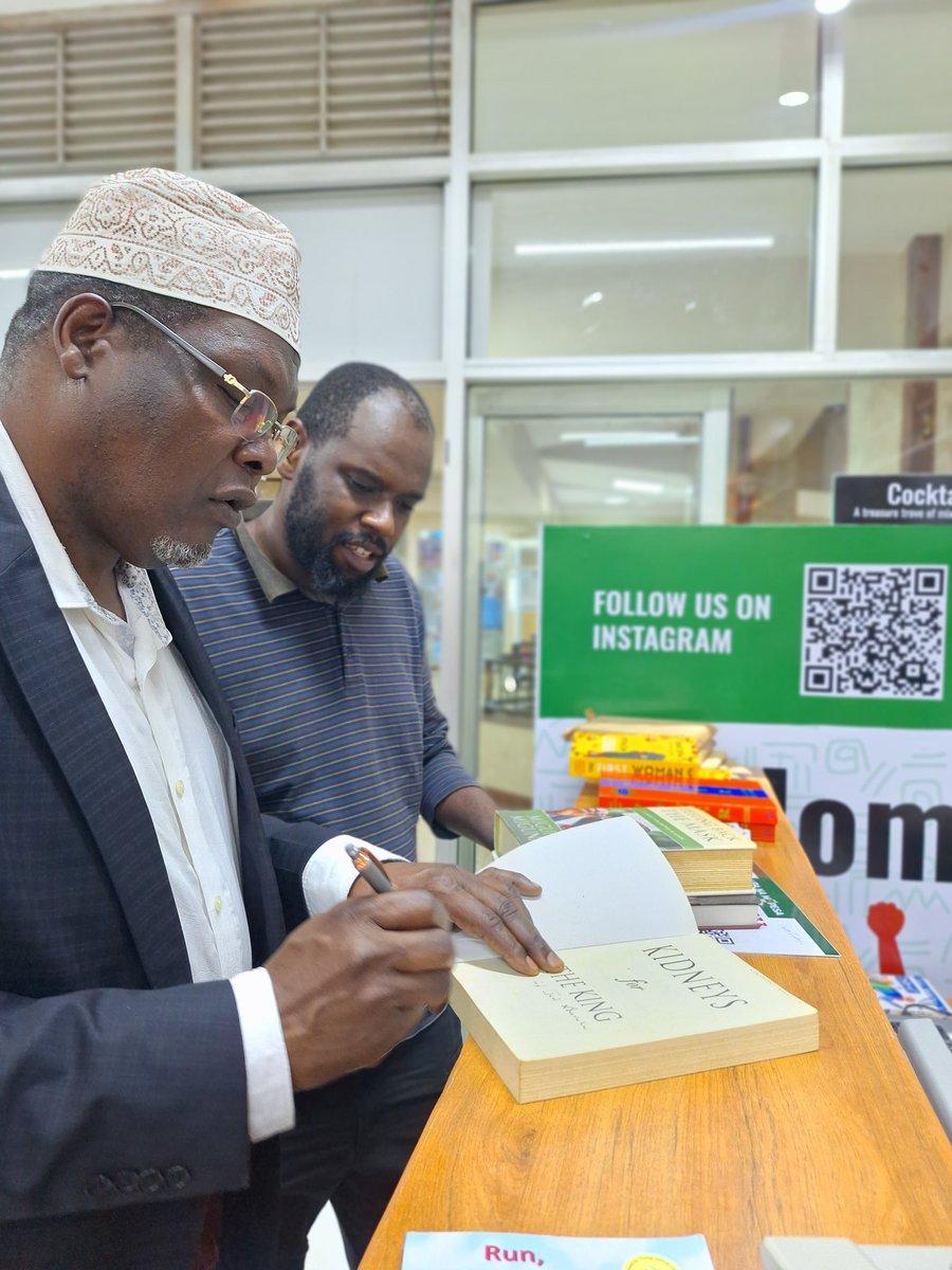 General Dr. @MigunaMiguna signing his books at Nuria Bookstore Kenya.