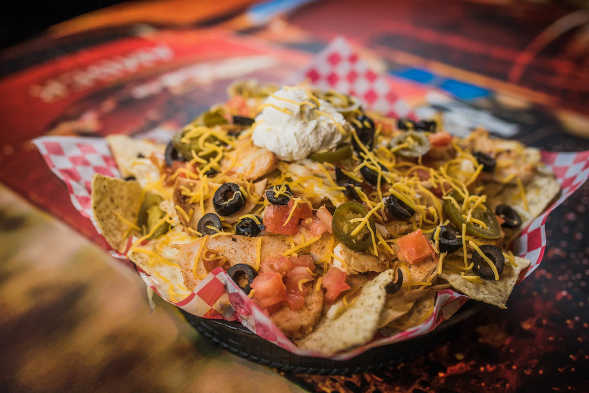 🥙 Stacked high and loaded with flavor! Our nachos are a messy masterpiece, with melted cheese, jalapeños, olives, tomatoes, and a dollop of sour cream. 

Are you ready to tackle this mountain of yum? 

#spacealiens #fargo #NachosSupreme #TastyTreats