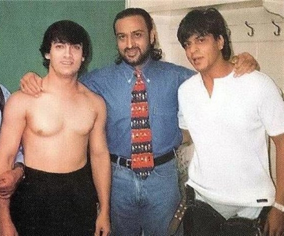 Crazy throwback... And my 3 questions: Why is #AamirKhan shirtless? Why is #ShahRukhKhan's pants loose? Why is #GulshanGrover wearing that tie? Now caption this...