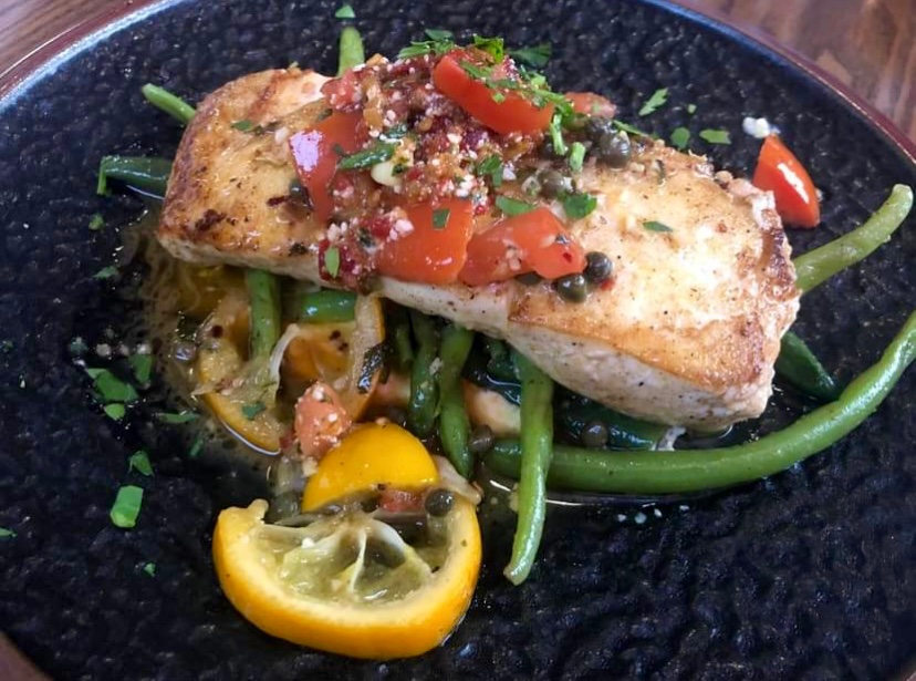 Join us today for our weekend specials which includes this pan seared halibut! We’ve also got live music from Brandon Callies at 6:00. #fattoamano #italianfare