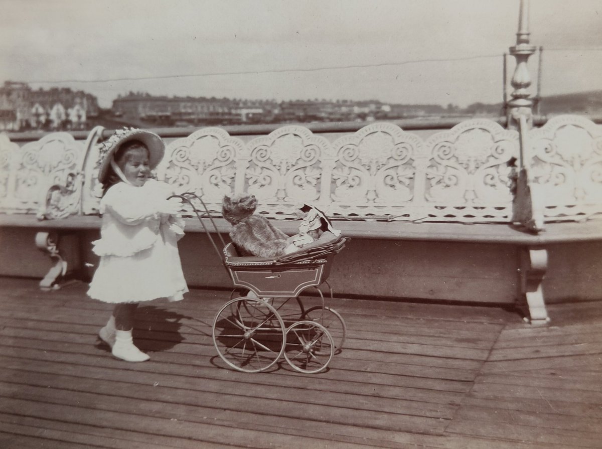 Taking Teddy for a walk on the #pier. The little girl's outfit is as flouncy as the iron railings #SaturdaySnaps