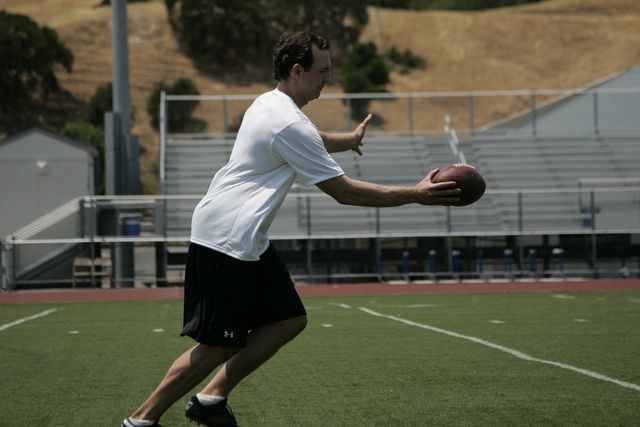 Pro punter Nick Harris demos guide hand release show how to punt a football