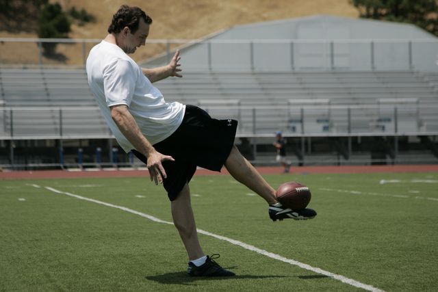 Football impact with punting foot demo by former NFL pro punter Nick Harris