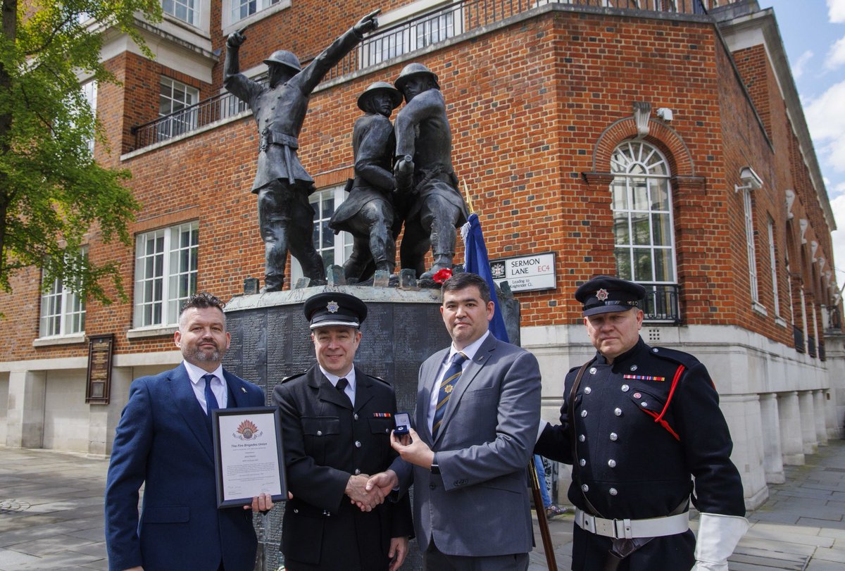 James Chapman Borough Commander for City of London receives his 25 year FBU badge from EC member David Shek, London regional Treasurer Adam Shaw and North East Area Chair Nathan Cane