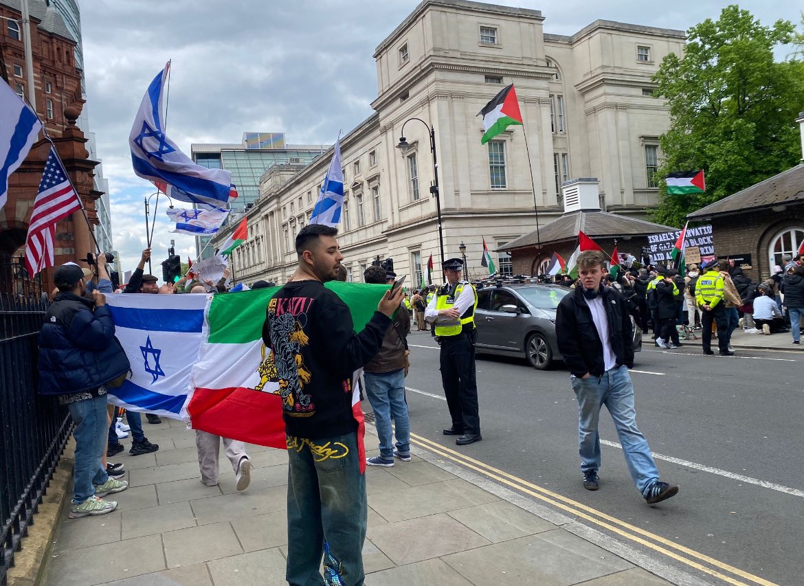 The counter demo has arrived outside UCL waving flags for UK, Israel, pre Republic Iran and the USA. @EIE2024