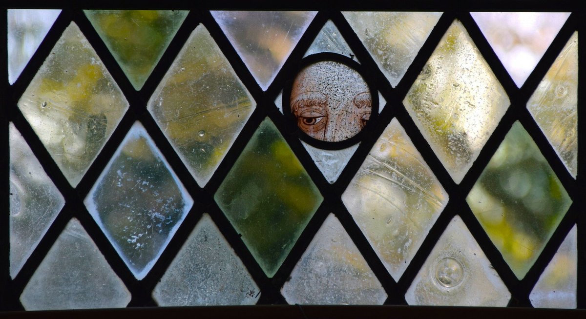 Medieval stained glass fragment incorporated in a later window at the church of All Saints, East Barsham.