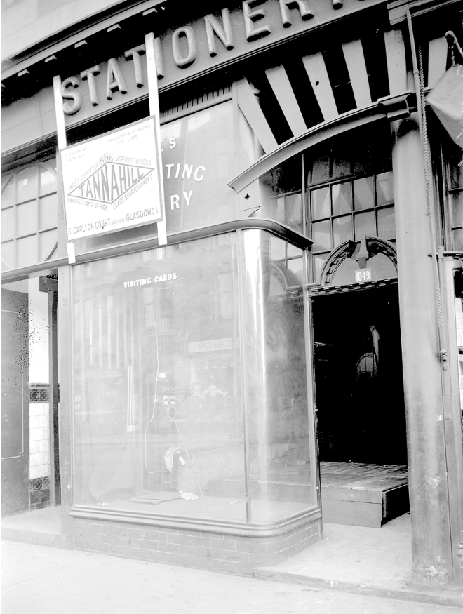 Turns out Tannahill started out as shop-fitters at the turn of the century, and were busy with this lovely shopfront on Pollokshaws Road in Shawlands. Note the detail in and above the door, the curved glass windows, and the fanlight over the close. Lovely.