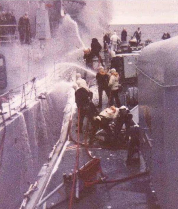 May 4th 1982: HMS Yarmouth joins in the rescue and over 200 sailors clamber to safety, as every effort is made to save the ship, with many resorting to buckets of water. Captain Sam Salt recalled that it was 'something I'll never forget. A pathetic attempt but marvellous spirit'.