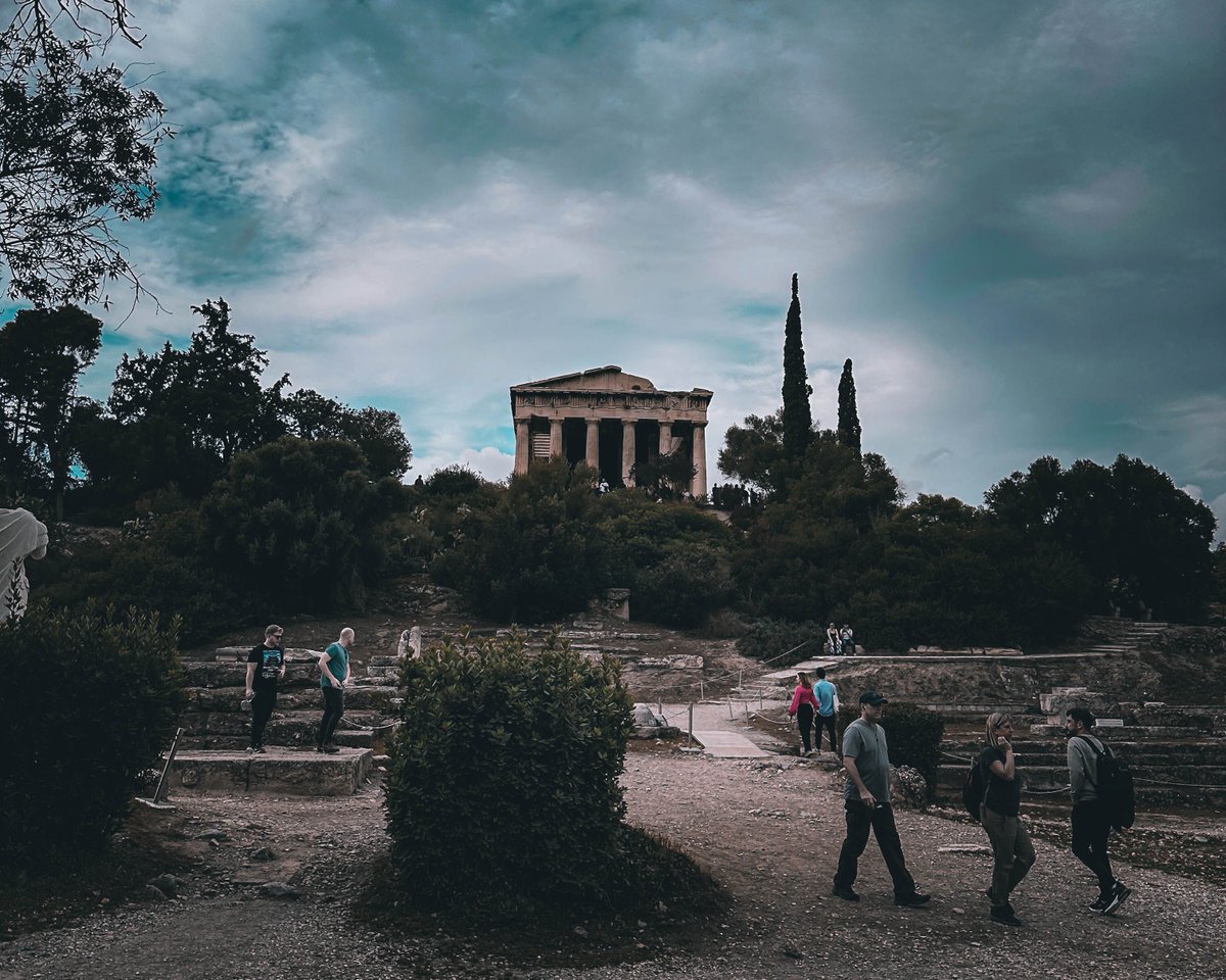 📸 Discover the tranquility of the park nestled below the towering Acropolis, where nature's beauty meets ancient majesty. Sunlight filters through the lush greenery, it casts a magical glow on the historic surroundings. #photography #travelphotography #outdoors #greece #athens