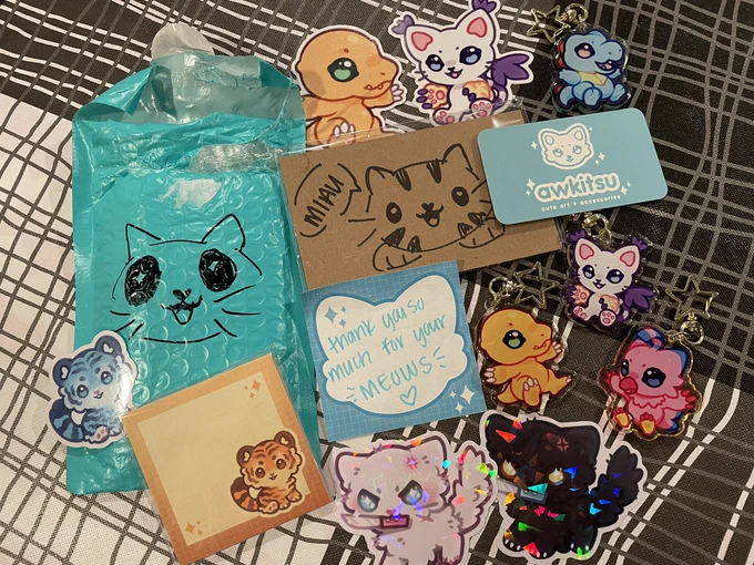 i received my package from @awkitsu !! THANK YOU FOR THE MEOWS 😭😭😭😭😭‼️‼️‼️‼️everything is so cute and shiny 🥺🫶 
