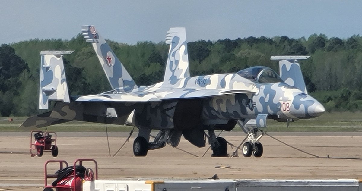 F/A-18E Super Hornet aggressor training aircraft of the Fighting Omars of Fighter Squadron Composite 12 (VFC-12) on the flight line at Naval Air Station Oceana, Virginia on 12 April 2024