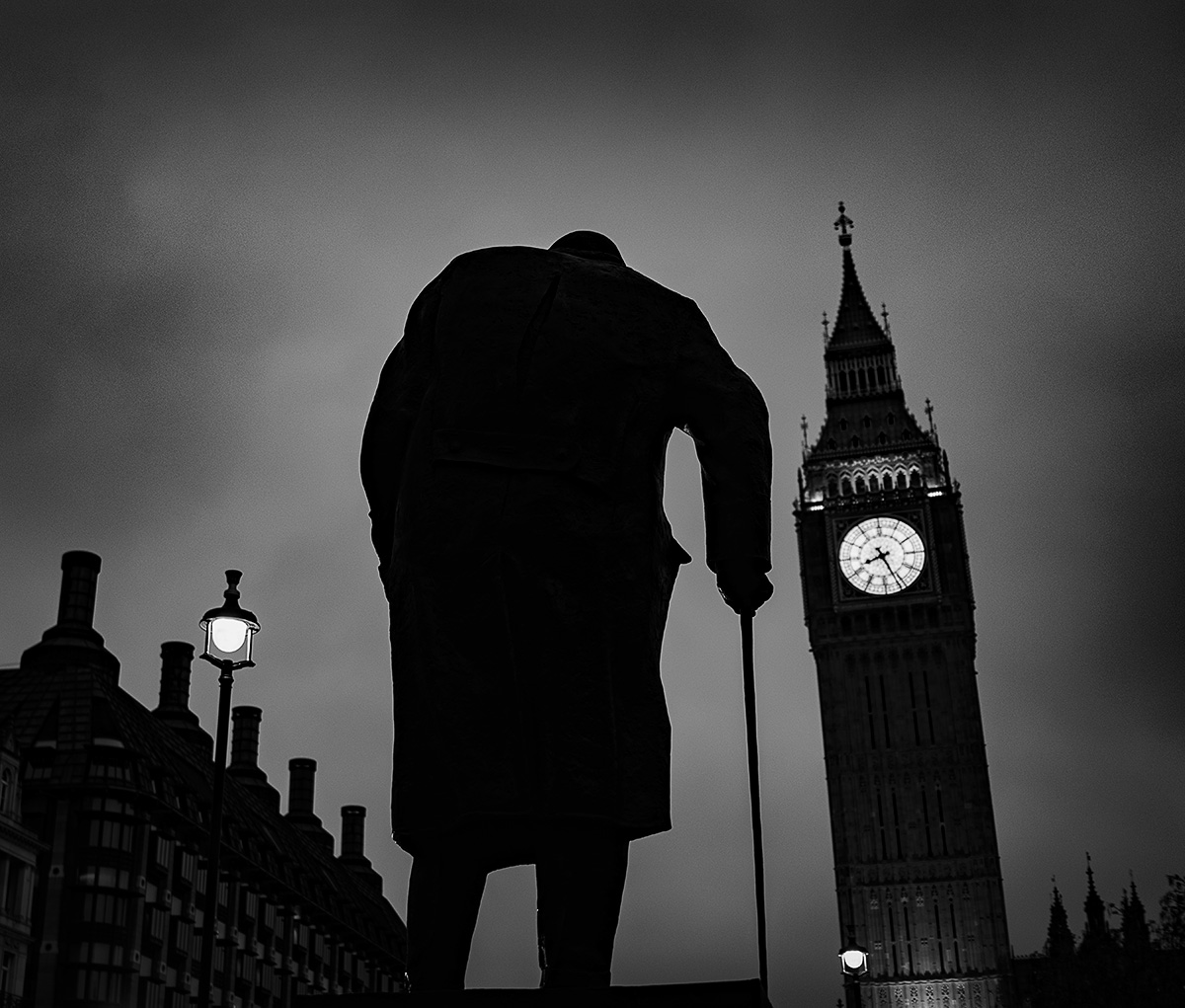 A Statue of Winston Churchill appears to be walking toward Big Ben on a dark London evening. #sony #RX1R  #sony#RX1Rm2 #winstonchurchill #bigben #history #england #eveningglow #tower #clock #towers #clocks #styleblogger #skycrapers #london #winston #blackandwhite #skyhigh