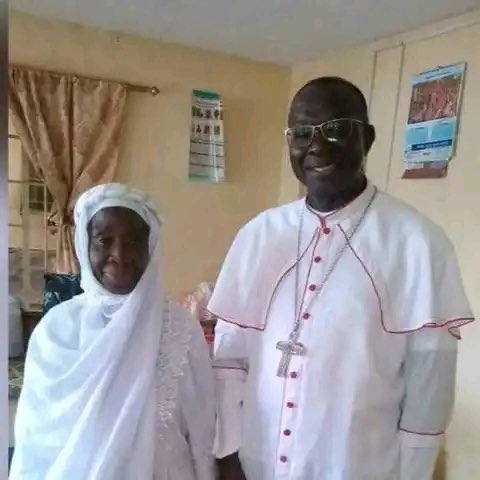 MOTHER & SON 🙏❤️
Her son took her to the praying ground, waited in the car till after the prayer & drove her to her home following the Eid Prayer in Freetown, Sierra-Leone. 
They both took this picture. Her son is the Catholic Bishop & she is a devout Muslim.
Religion is not war