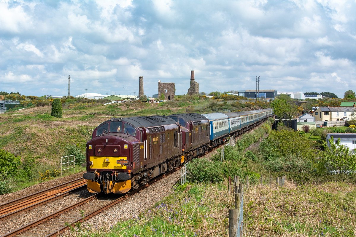 WCRC 37668 and 37518 pass the remains of Cook's Kitchen mine at South Crofty between Redruth and Camborne with Pathfinder Railtours' 'Cornish Spring Explorer' (1Z65 05.55 Dorridge - Penzance) on 4 May 2024.